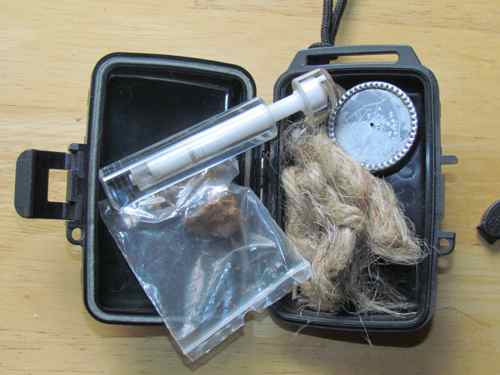 My fire piston kit with chaga, tinder, and cleaning tool (Photo: Mark A. Zeiger).
