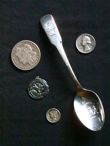 Secondhand silver: coins, silverware, and an Alaskan state seal medallion (Photo: Mark A. Zeiger).