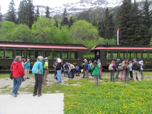 "Desperados waiting for a train?" Symposium trip to Laughton Glacier Station on the White Pass/Yukon Railroad. (That's Heather Lende in the blue/green coat on the left). (Photo: Mark A. Zeiger.)