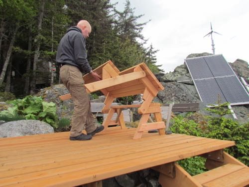 folding out the picnic table bench