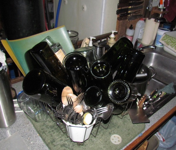 dish drainer full of bottles